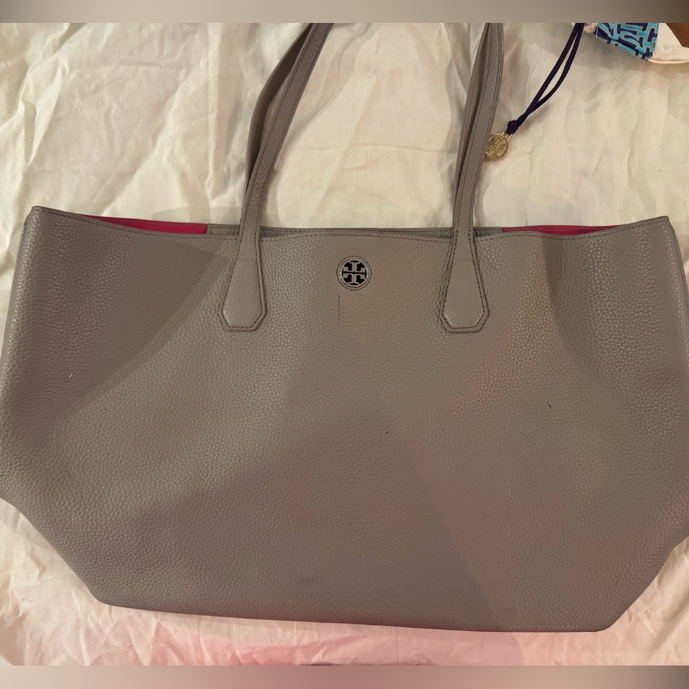 Tory Burch Tote color taupe with fuchsia interior.
